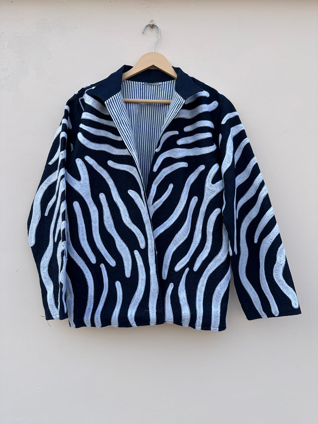 Indigo Wave Embroidered Denim Jacket with Striped Lining